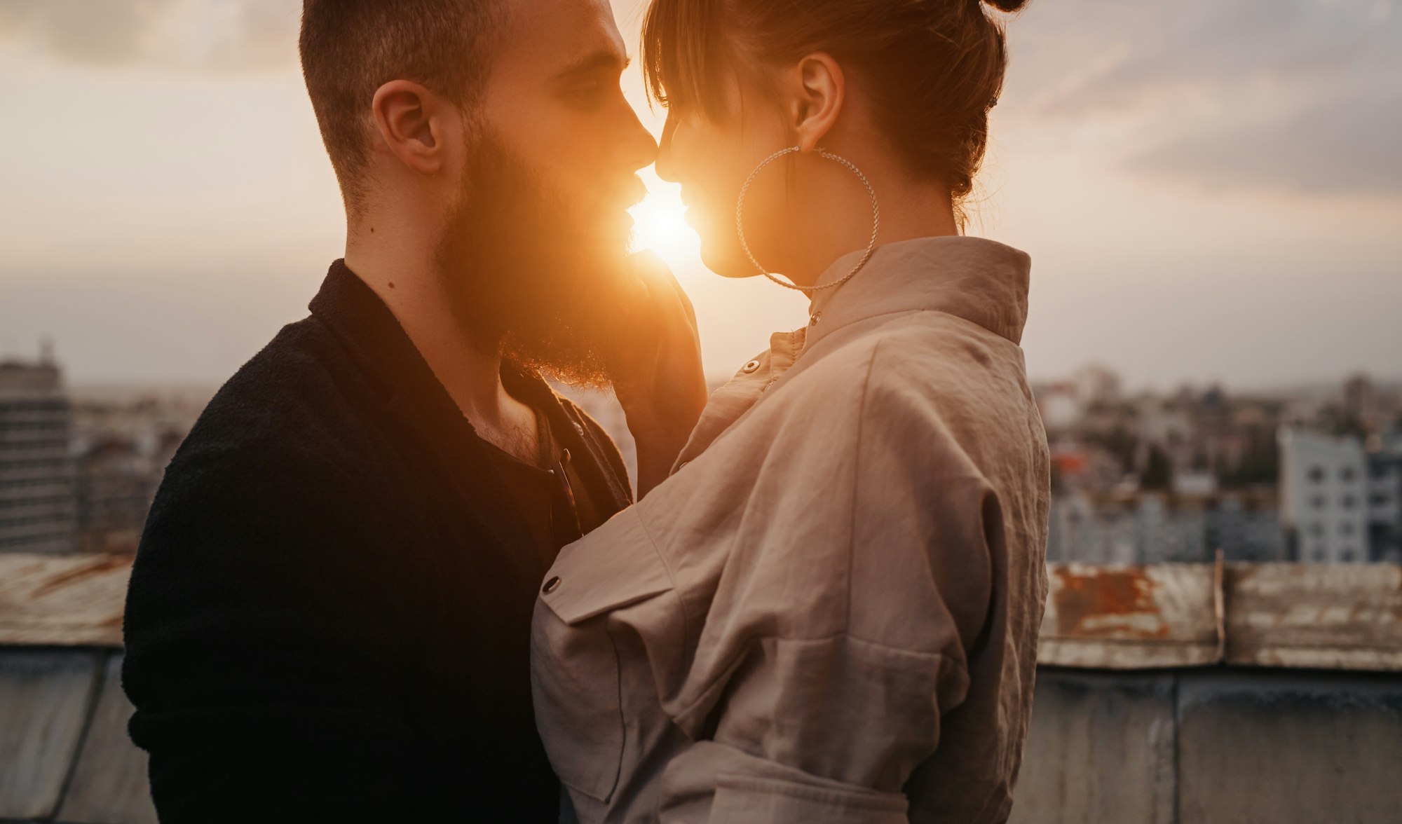 Young couple kissing during evening date