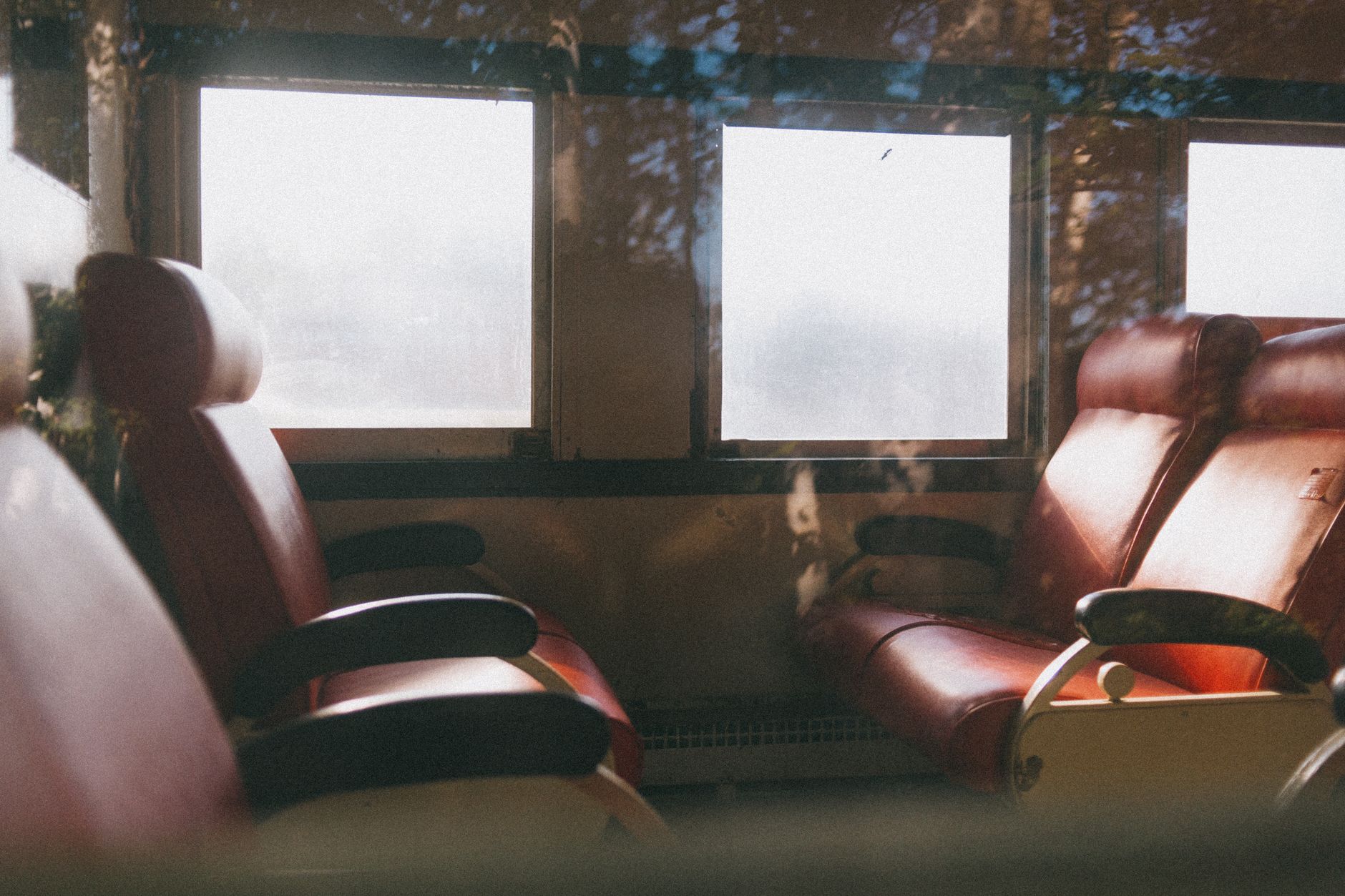 Spacious suite cabin on a luxury train with a double bed and sitting area