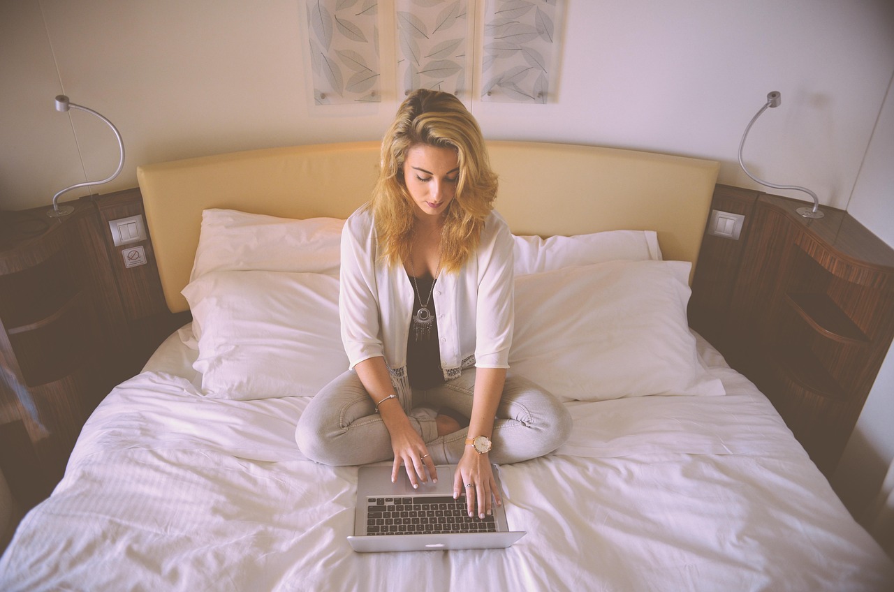 woman, working, bed, laptop, typing, female, business woman, person, computer, young, professional, concentrated, brown