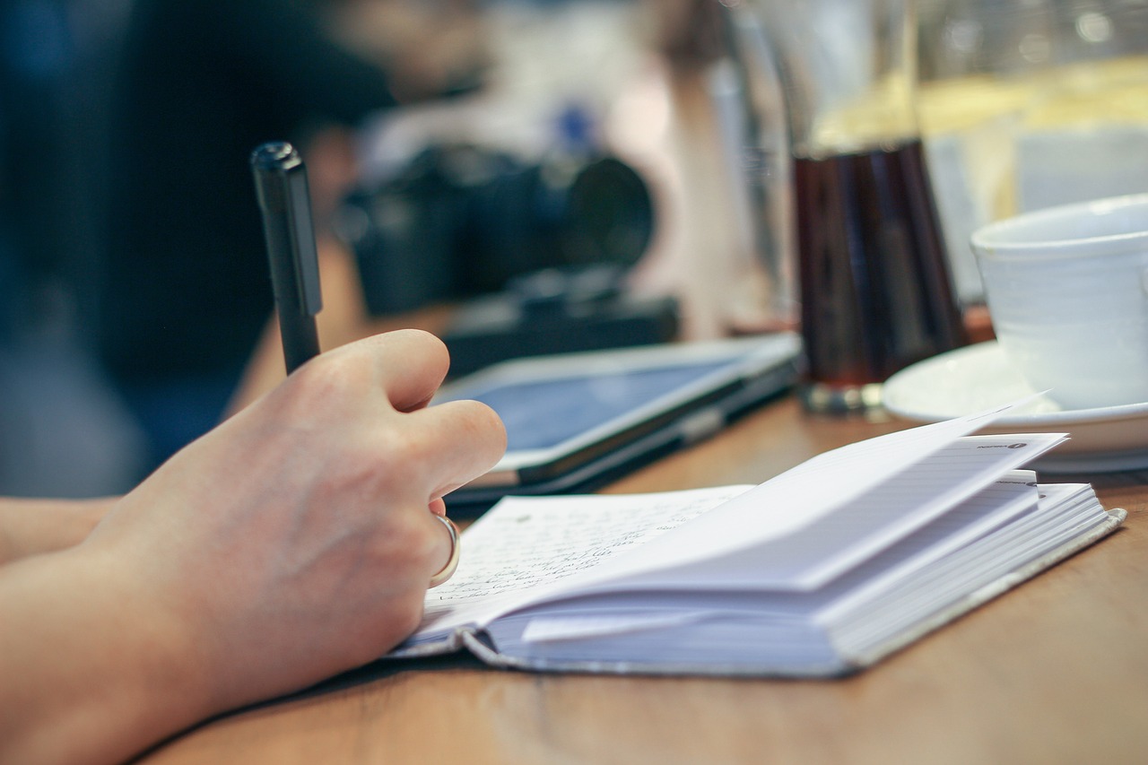 Waterproof travel journal notebook placed inside an open backpack