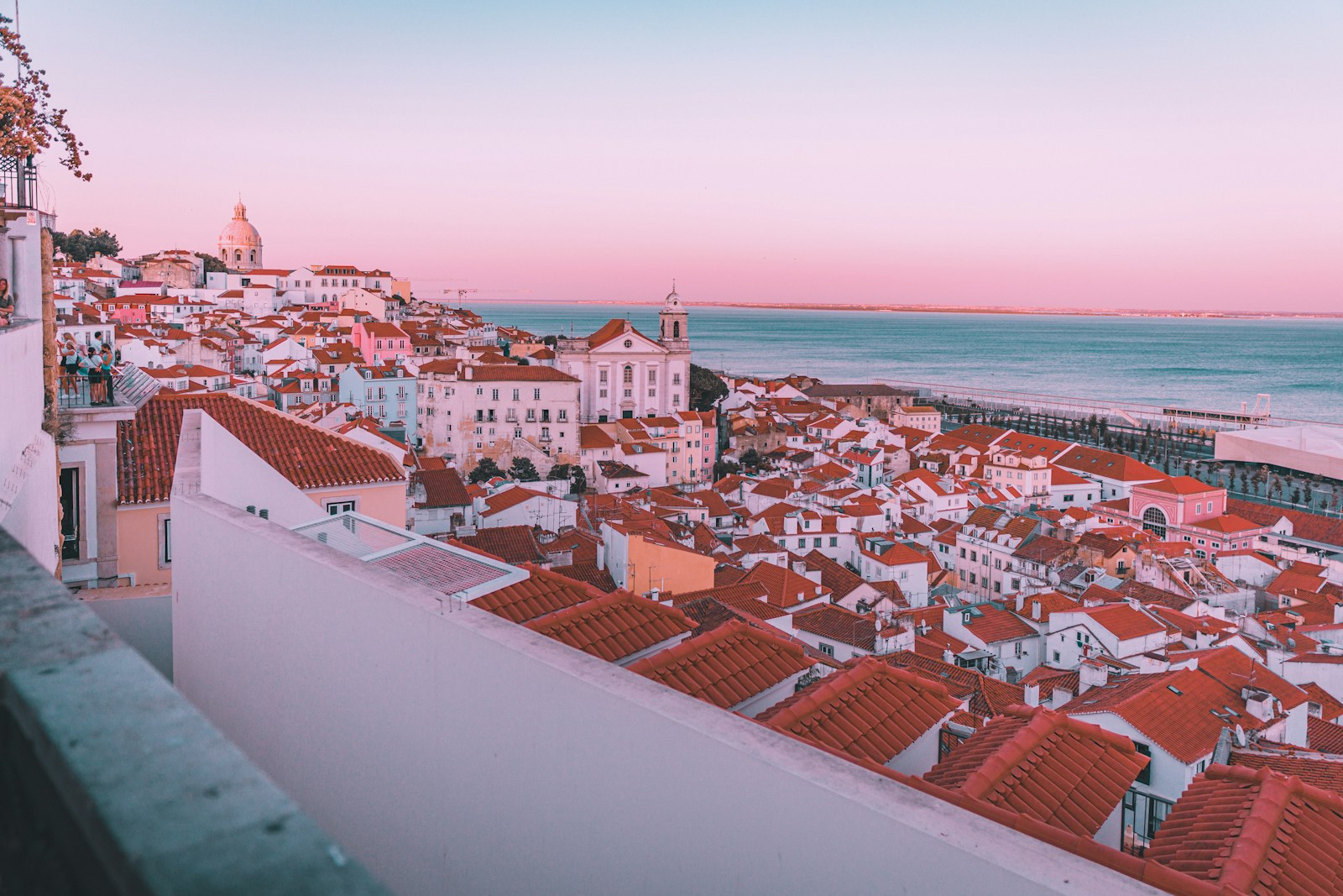 Hotel terrace in Lisbon overlooking the Tagus River and city skyline