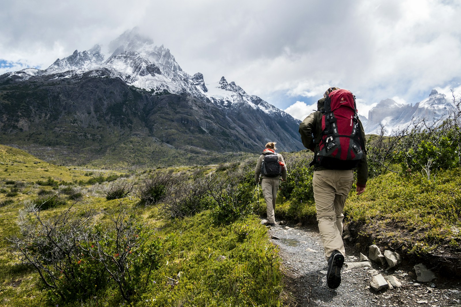 Backpacker exploring a vibrant street food market in Chiang Mai, Thailand