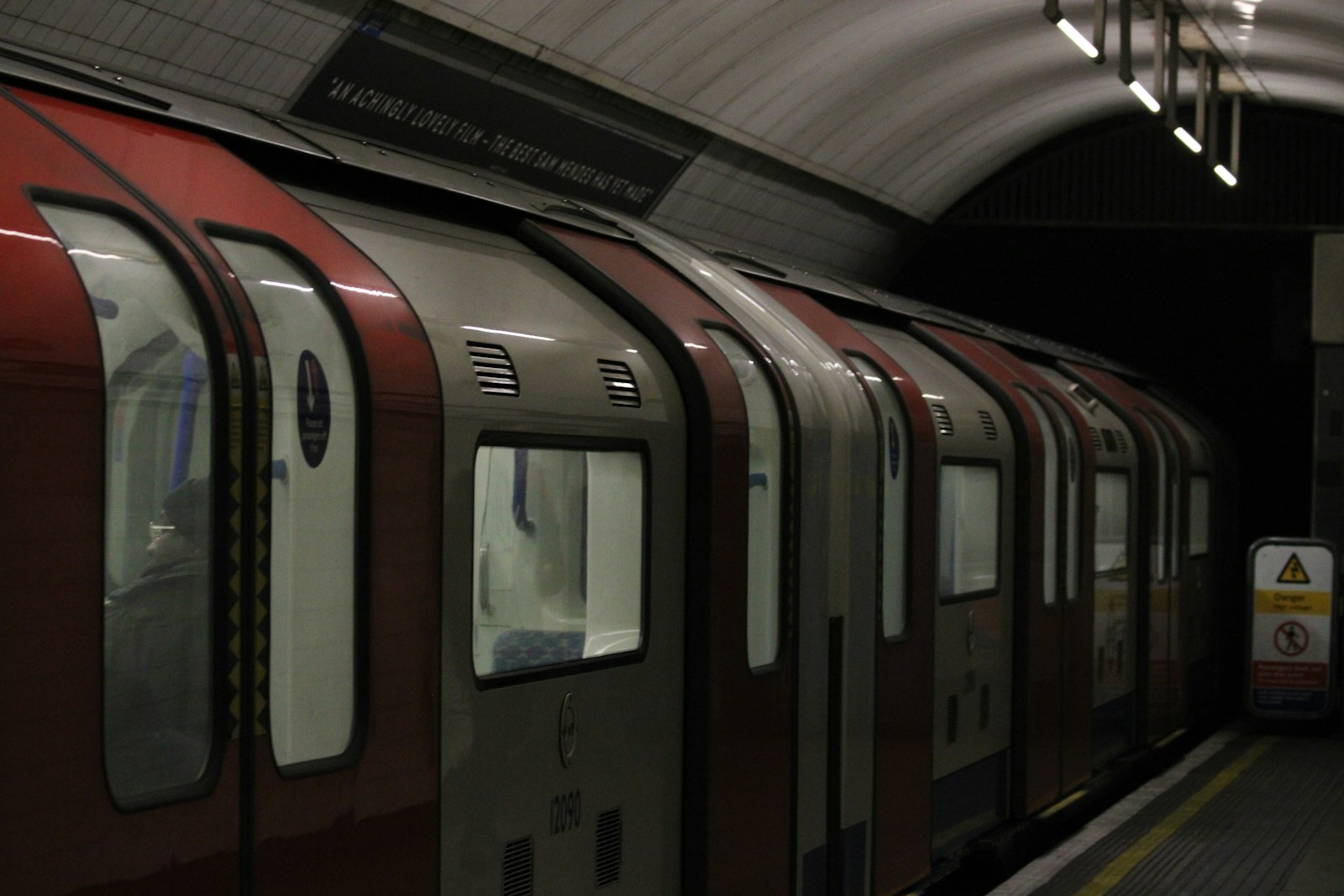 London Underground train arriving at a station platform