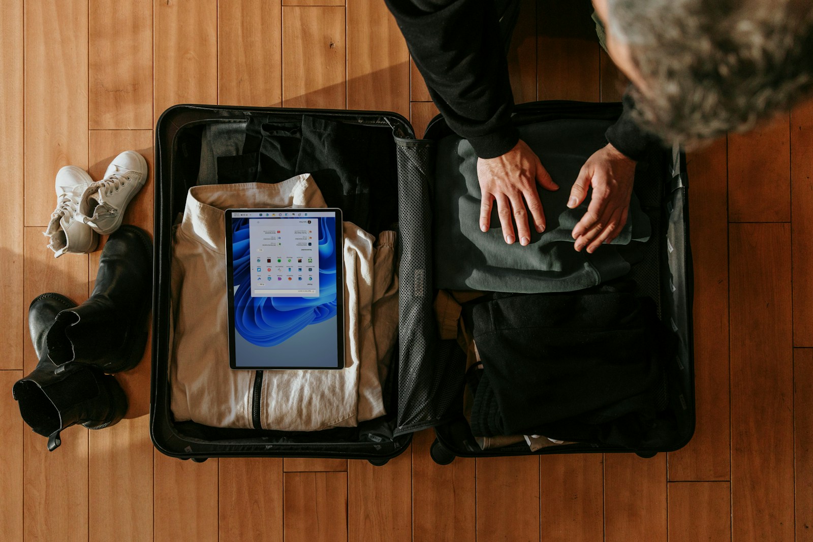 Travel backpack with packing cubes on a train seat ready for a European trip