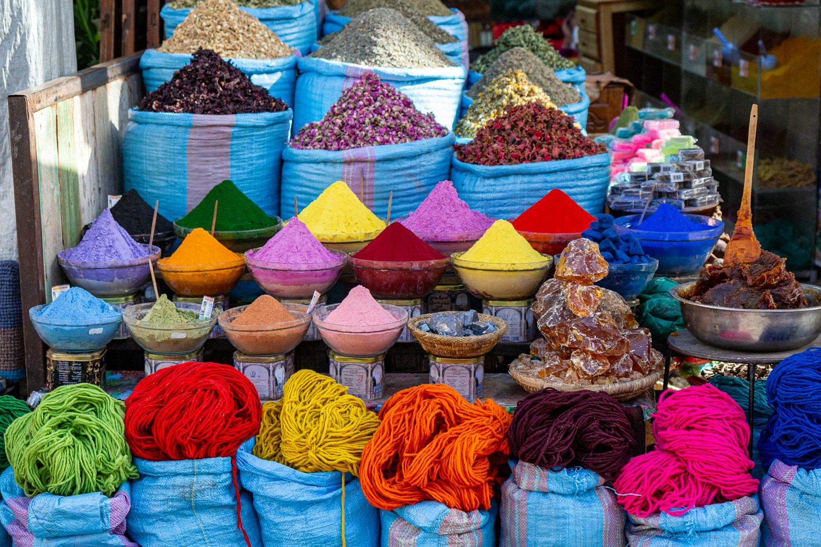 Colorful piles of spices for sale at a market stall in the Marrakech souk