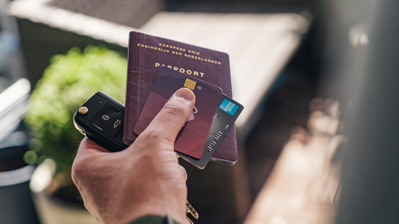 Traveler using a Global Entry kiosk at customs, with card and passport visible