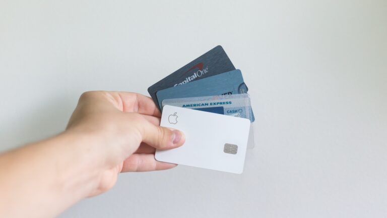 person holding credit cards and planning - unsplash