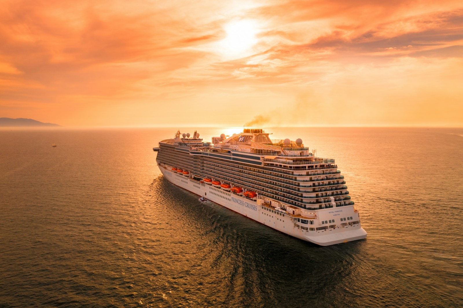 Guests disembarking a luxury cruise ship for a shore excursion at a tropical island