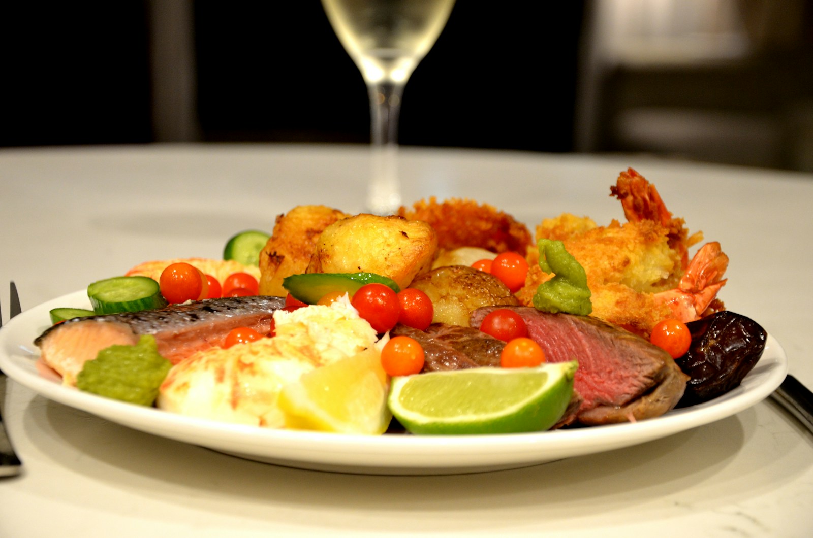 Plated gourmet dish from a celebrity chef tasting menu with artistic presentation