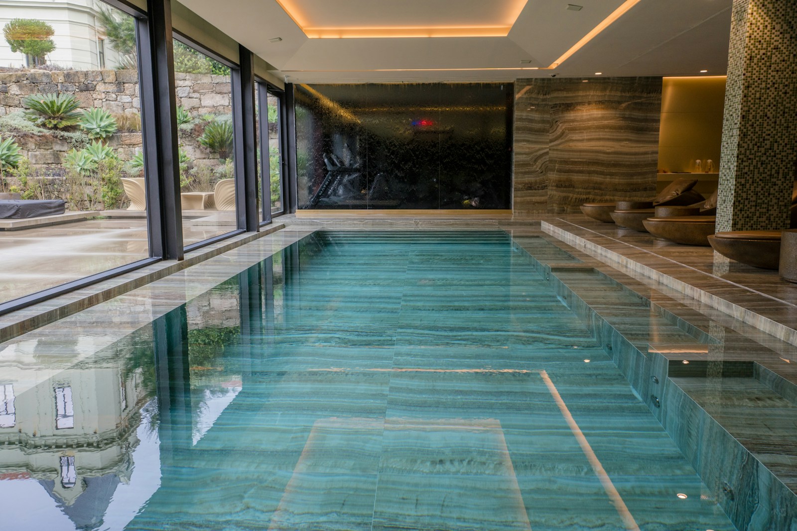 A serene luxury spa thermal pool with mountain views in Europe