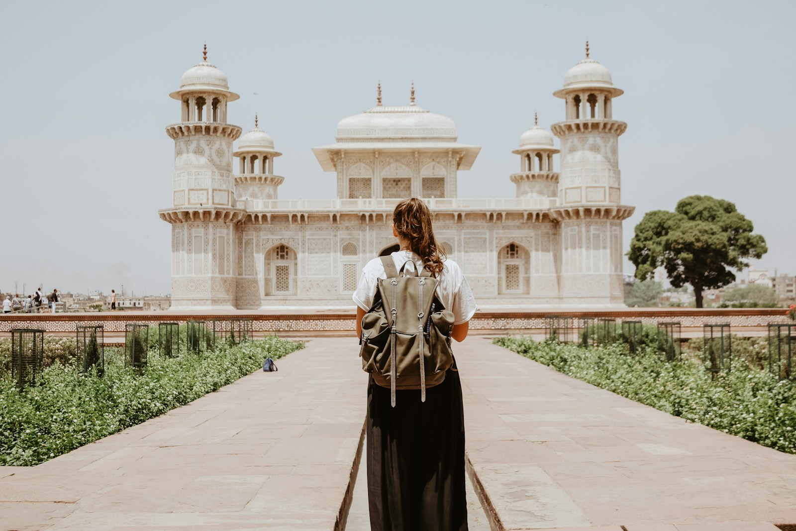solo female traveler arranging budget - unsplash